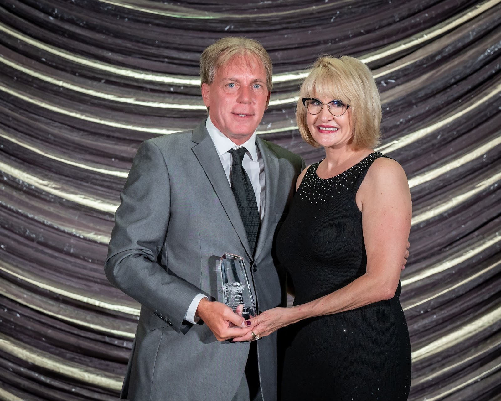 Two people posing for a photo
Description automatically generated with medium confidence