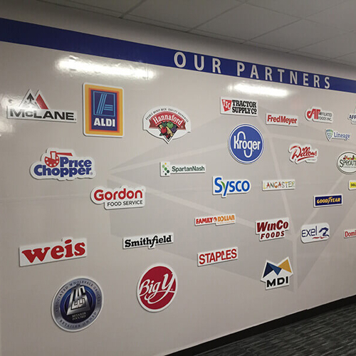 Different business names on the wall of the office