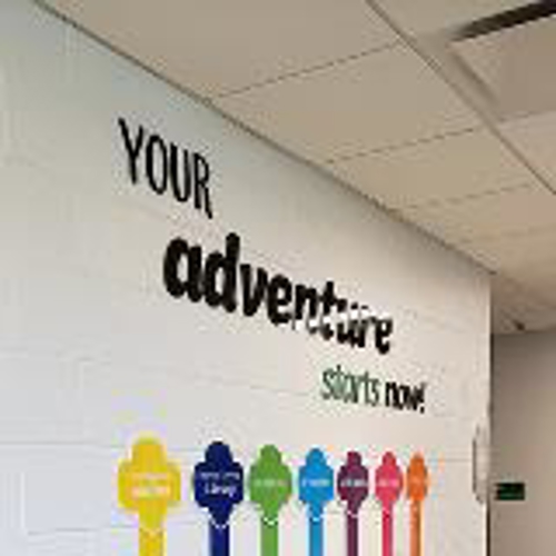 Your adventure colorful wall design with colorful line on the floor inside the office