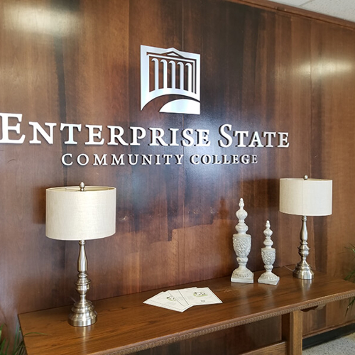 Enterprise state Logo on the wall office with lamps and table