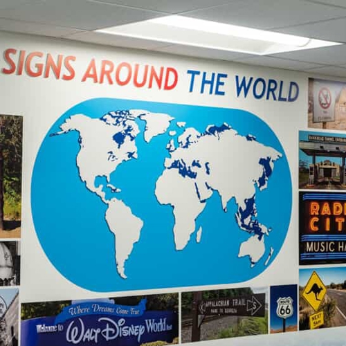 Signs around the world sign with world map wall graphic