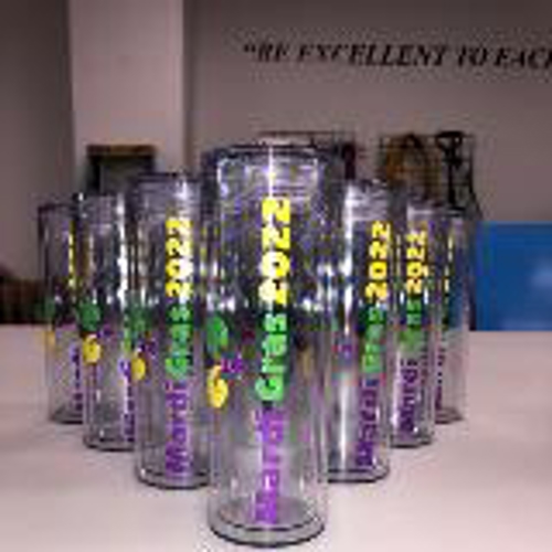 Promotional tumbler of Mardi grass on the table