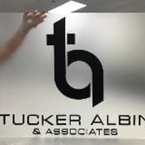 Tucker Albin custom decal holding by an employee