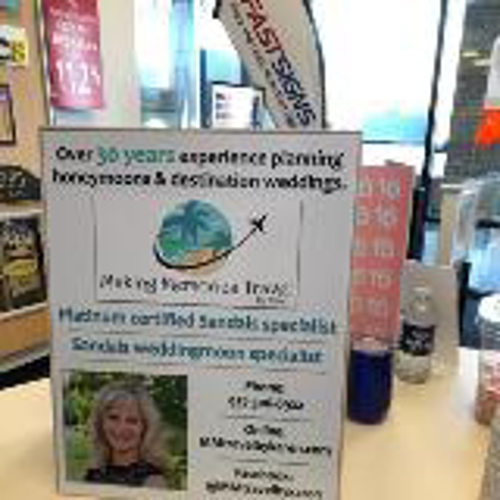 Custom wayfinding signage on the table of the store with fast sign feather flag on the back