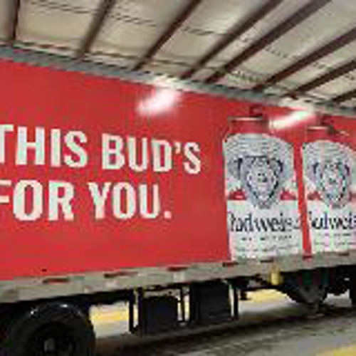 Budweiser Truck wrapped with graphics parked on the garage
