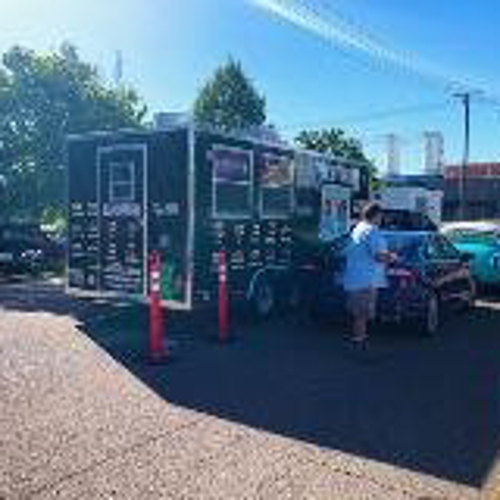 Carnivorum truck on the drive-thru with cars and people