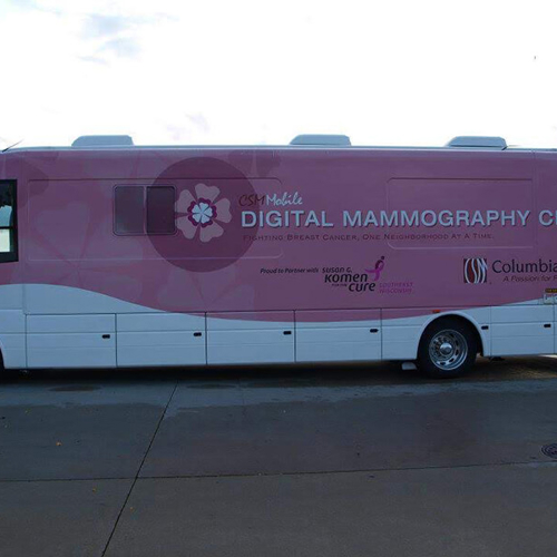 Bus wrapped with color pink and graphics