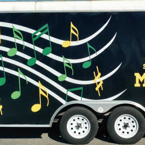 Truck wrapped with St. Edward high school marching eagles graphics