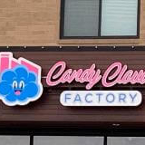 Pink and blue candy Cloud channel sign on the building