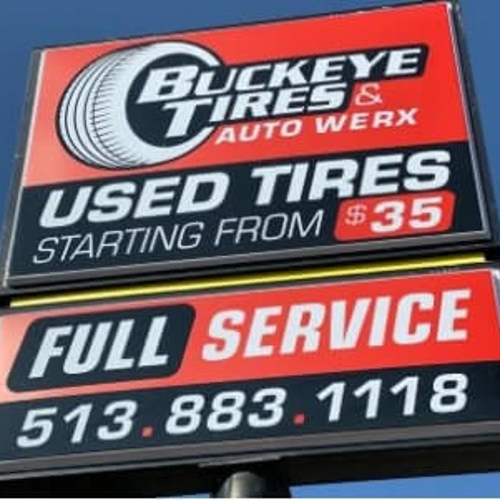 Buckeye Tires signage in the sunny weather with color black and red as  background