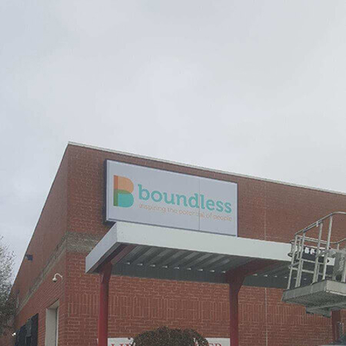 Boundless sign on the building wind waiting shed and car on the front