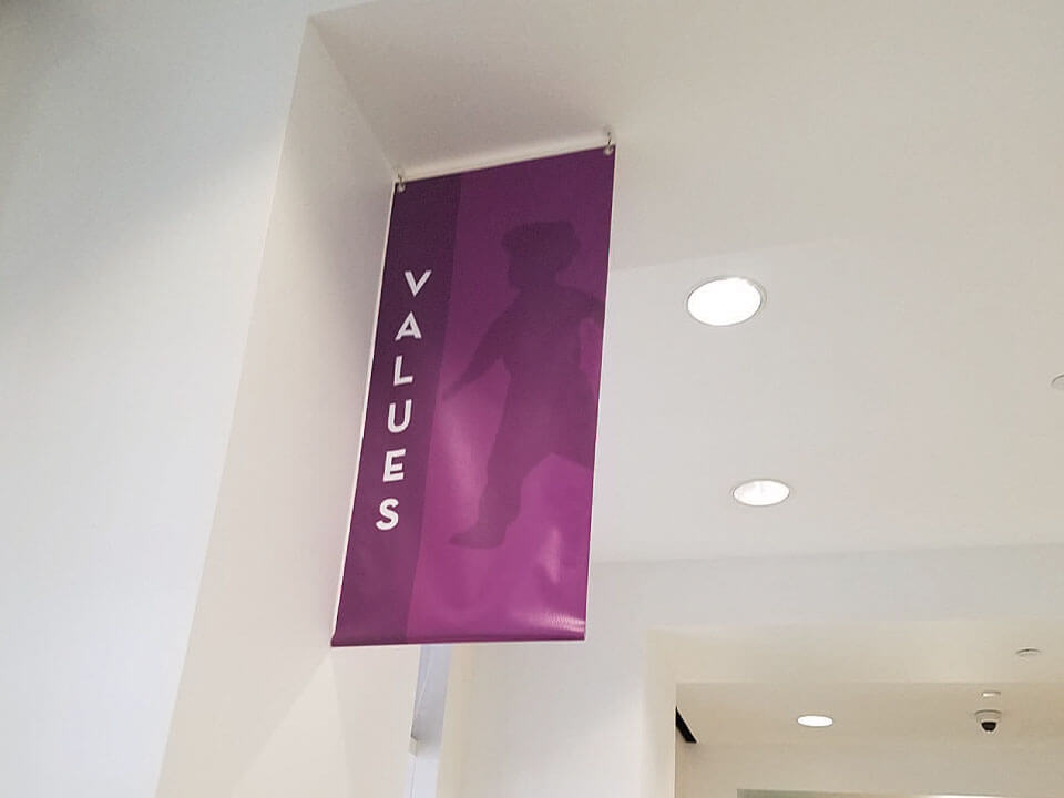 A custom banner that reads “VALUES” installed by FASTSIGNS in West Virginia