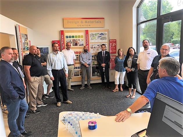 Franchise owner talking with staff