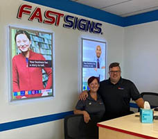 Two members of the FASTSIGNS White Marsh Joppa team