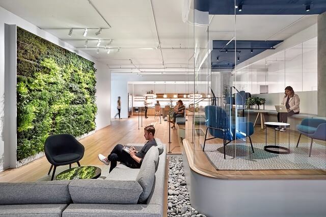 employees work at various areas of an office