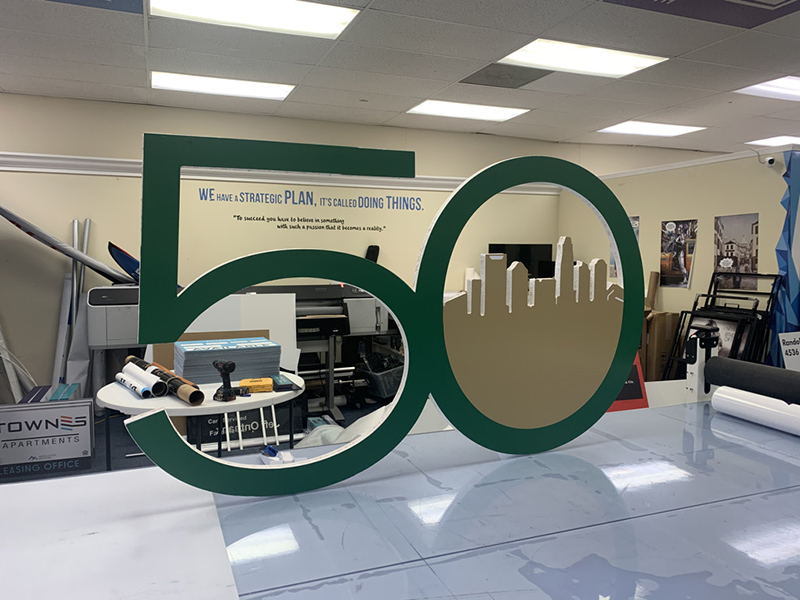 the number "50" with a skyline in the zero