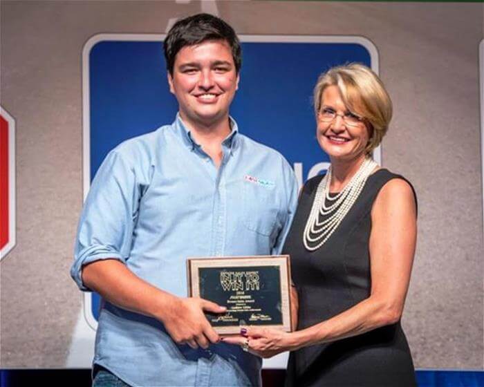 Andrew Gibbs receiving award