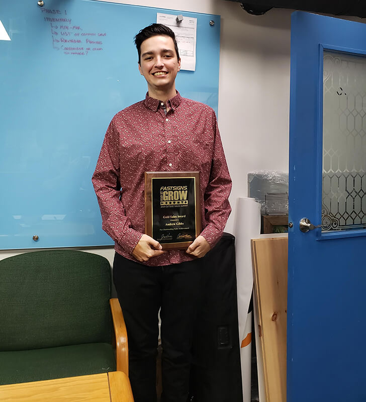 FASTSIGNS® of Toronto’s Andrew Gibbs displaying his Gold Sales Award from the 2019 Outside Sales Summit