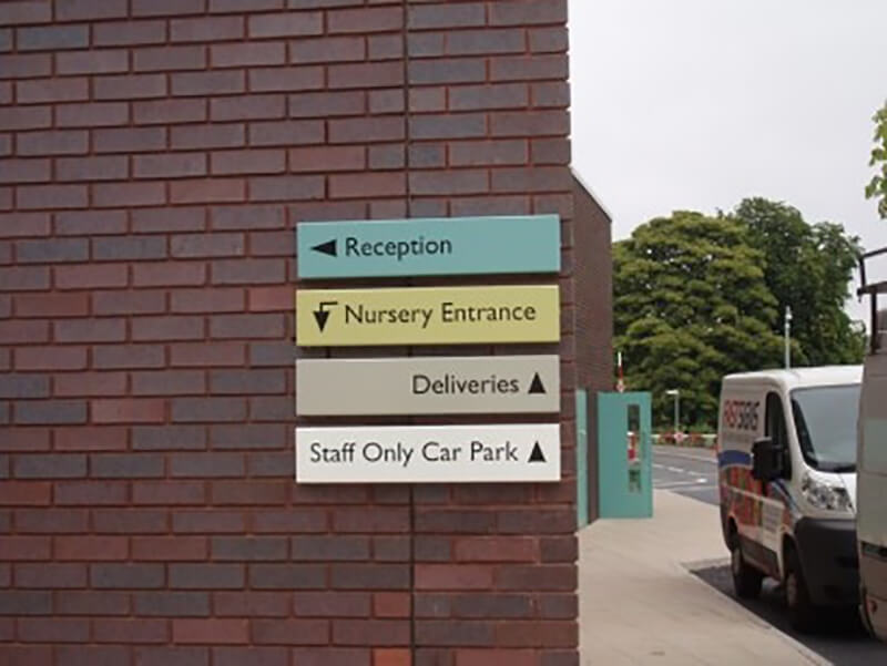 wayfinding signs on building