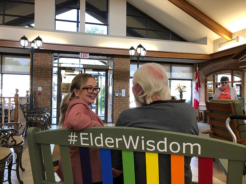 woman talking to resident of The Village of Winston Park