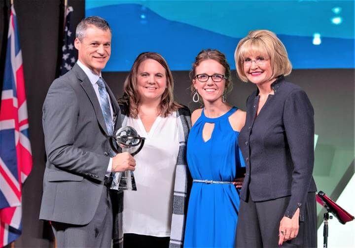 The team at FASTSIGNS® of Grand Rapids receiving the Sales Achievement Award at the 2020 FASTSIGNS International Convention