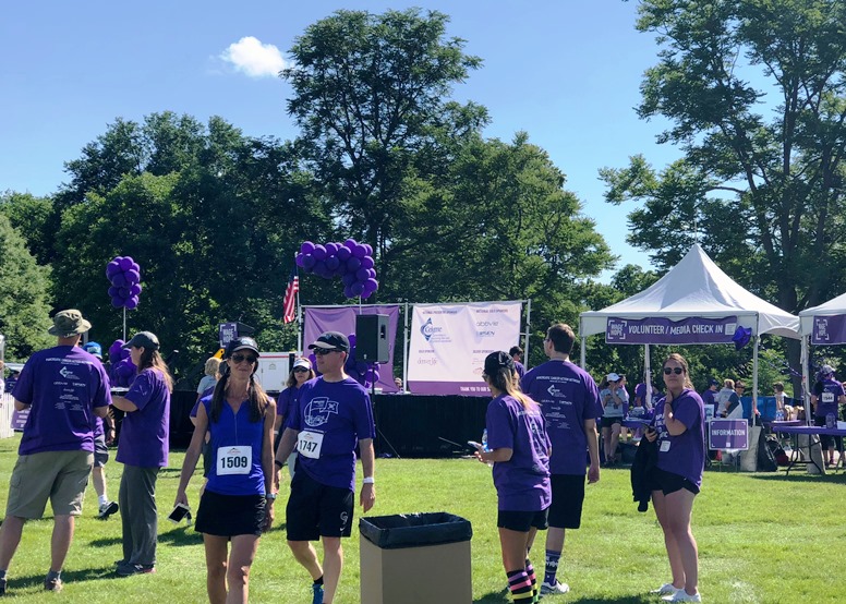 a pancreatic cancer event full of purple t shirts and booths