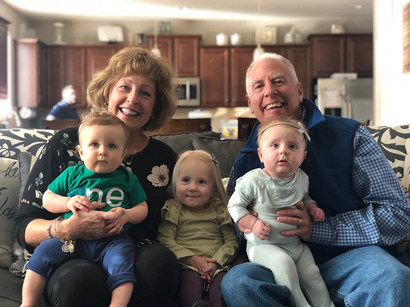 hayden sits among family members