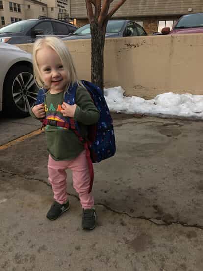 Hayden stands with a backpack on