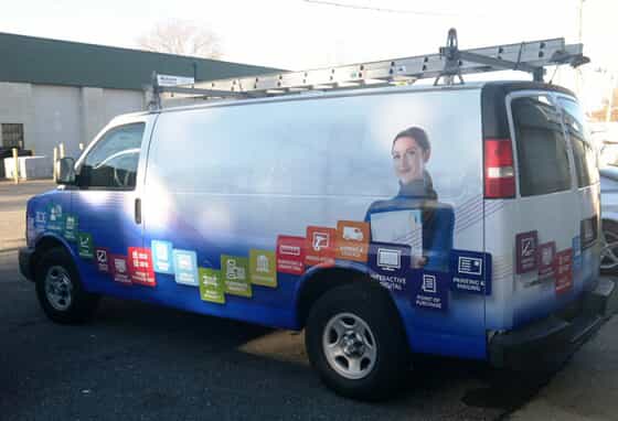 a van with fastsigns graphics on it