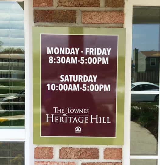 hours of operation are posted outside a door