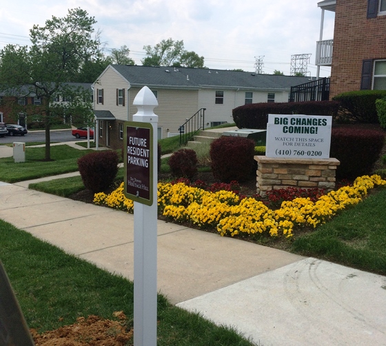 a sign indicates a parking spot for future residents