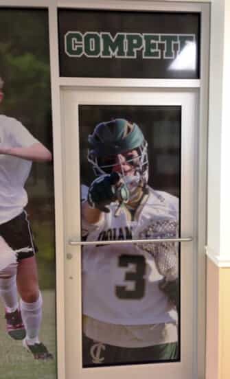 window murals are placed around the athletics department of indian creek