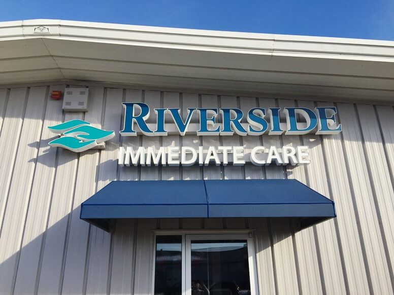 exterior building sign with matching awning
