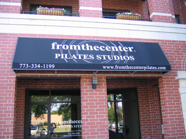 custom printed awning outside of pilates studio